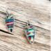 Cowgirl handmade dangle earrings shaped like arrowheads